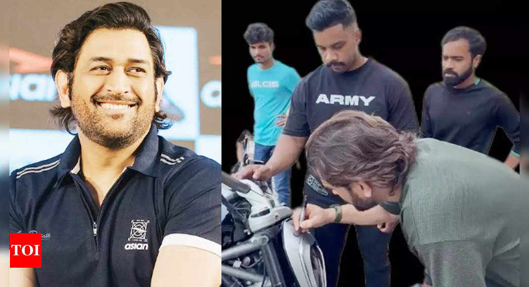 MS Dhoni wins hearts again, signs fan’s bike in a heartwarming gesture – WATCH | Cricket News